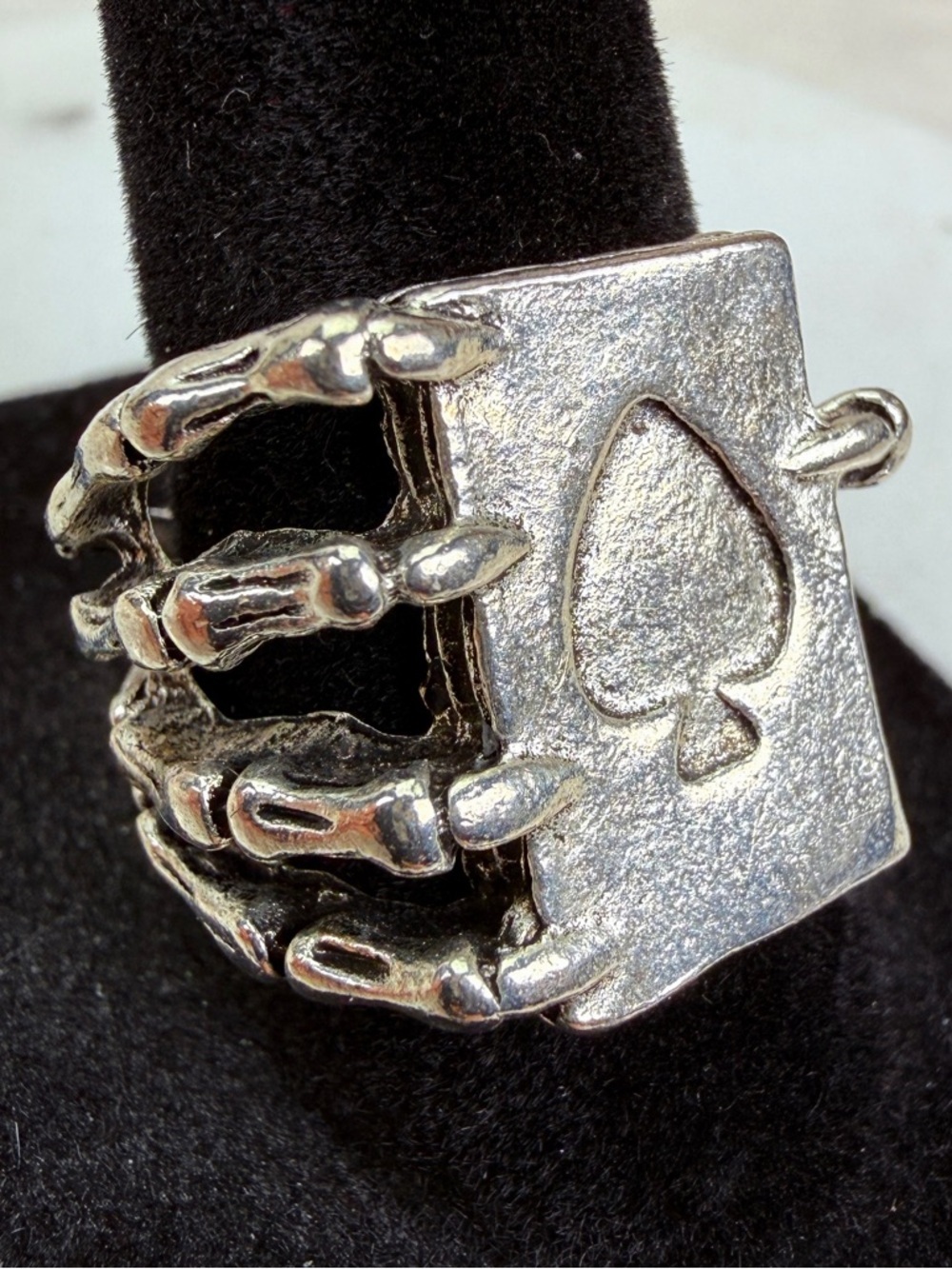 Silvertone, bone hand spade card, size 8 costume ring